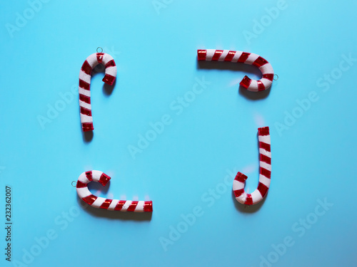 Christmas candy cane drums  at studio above view over a light blue background isolated flatlay
