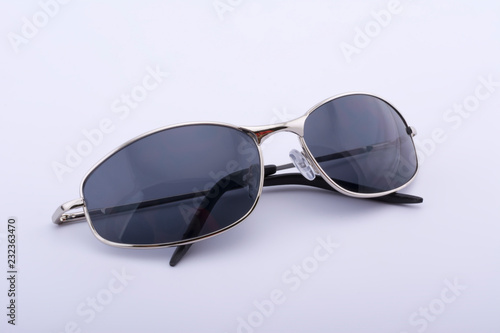Gray sunglasses with a golden rim