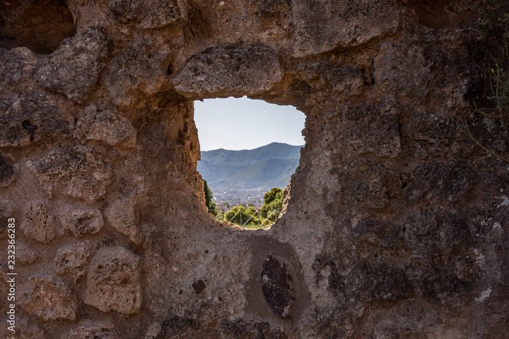 A Window through the old roman ruins in Pompeii, Italy