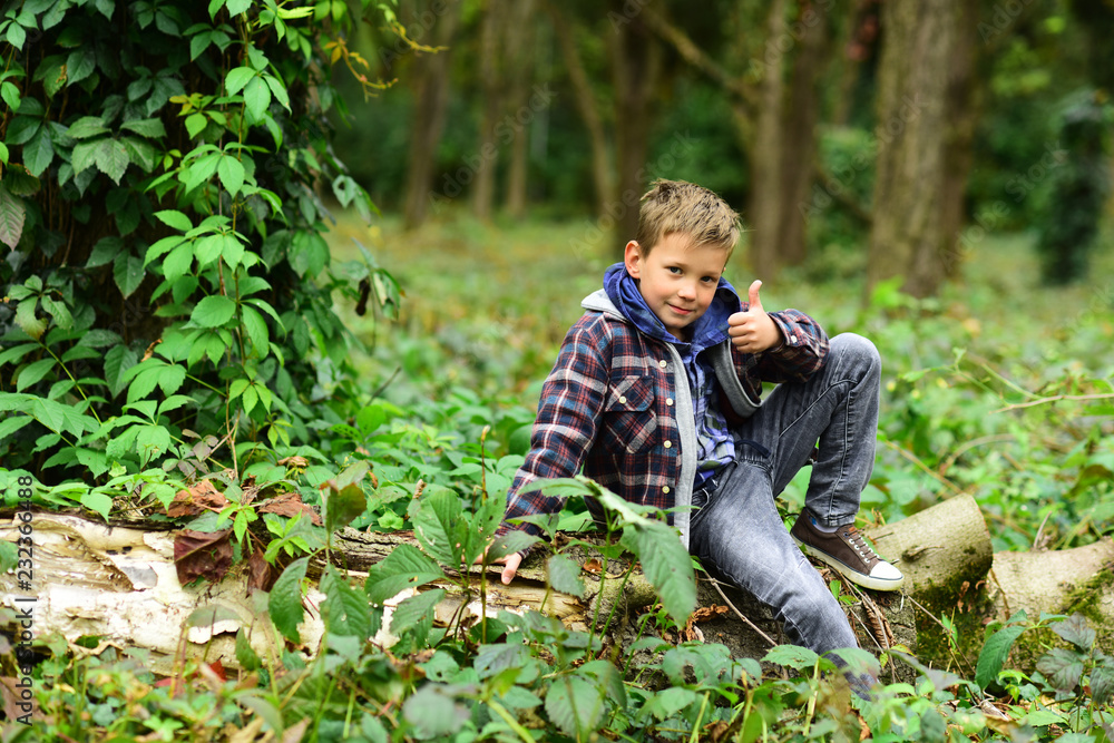 Start being successful. Small boy celebrate success. Small boy show thumbs up in woods. Success is a journey not a destination Start being successful. Small boy celebrate success. Small boy show thumbs up in woods. Success is a journey not a destination