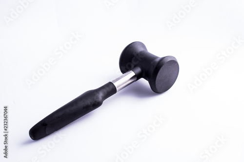 Meat mallet or tenderizer; black plastic and metal; issolated on white background