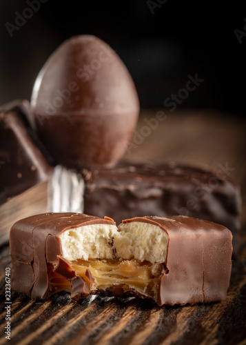 Chocolate candies on a wooden background. Close-up photo