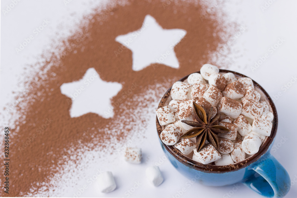 Blue cup with marshmellow cacao powder and star. Blue cup with marshmellow cacao powder and star.