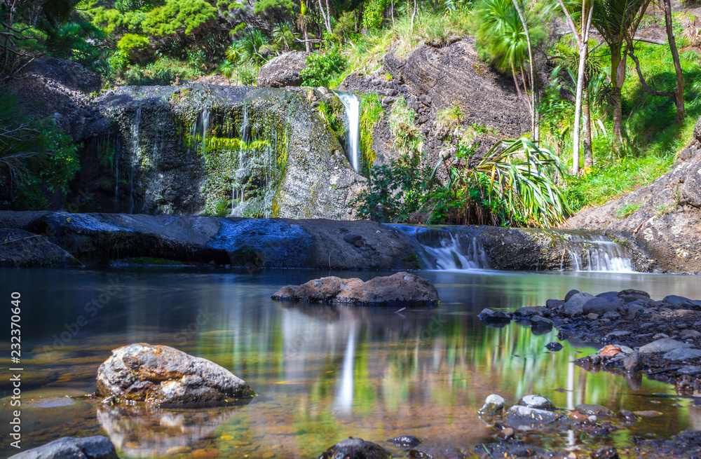 Peaceful Place and Calm Water at Waimanu Waterfalls Bethells Beach Auckland, New Zealand Peaceful Place and Calm Water at Waimanu Waterfalls Bethells Beach Auckland, New Zealand