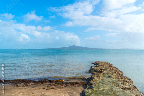 Boulder Rock and Landscape Scenery of St Heliers Beach Auckland New Zealand  View to Rangitoto Island  Calm Sea at Morning Time