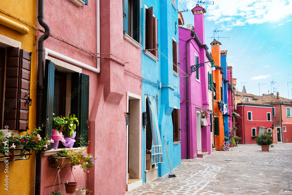 Beautiful street with multicolored houses, Burano island, Venice, Italy