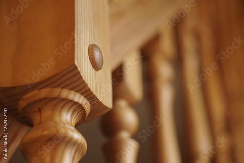 Obraz na plátně Close-up row of wooden column wooden stairs in wooden house
