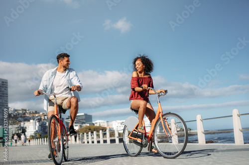 Tourist couple moving around the city on bicycles © Jacob Lund