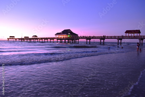Clearwater, Florida. October 21,2018 Panoramic view of Pier 60 on magenta sunset background at Cleawater Beach. photo