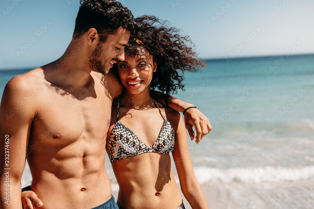 Couple walking on beach together
