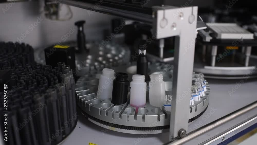 Immunology. Laboratory equipment, automation, modern automated machine in the working process, clinical chemistry analyzer, chemical pathology, Medical biochemistry, body fluids analysis, blood and Immunology. Laboratory equipment, automation, modern automated machine in the working process, clinical chemistry analyzer, chemical pathology, Medical biochemistry, body fluids analysis, blood and