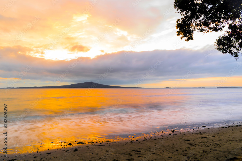 Landscape Scenery during Sunrise Time at Takapuna Beach, Auckland New Zealand; View to Rangitoto Island