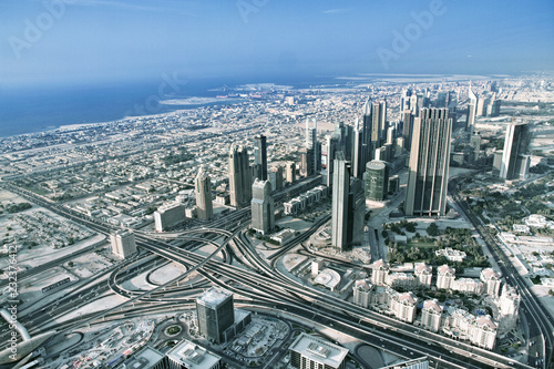 Aerial view. Dubai skyline with beautiful city close to it s busiest highway on traffic