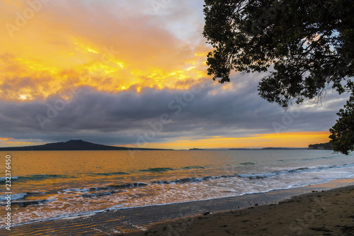 Landscape Scenery during Sunrise Time at Takapuna Beach, Auckland New Zealand  View to Rangitoto Island © Rangkong