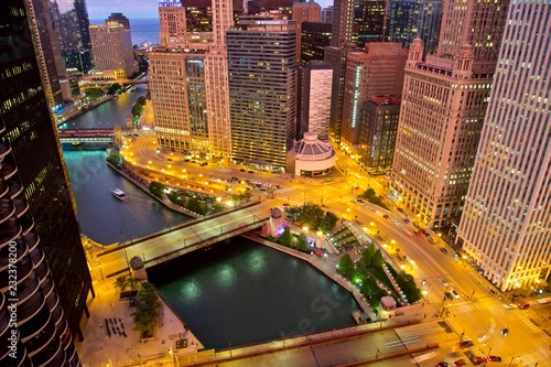 Aerial view of downtown Chicago after sunset at the blue hour. Wacker Drive, Michigan Avenue, Wabash Avenue and the Chicago River  photo