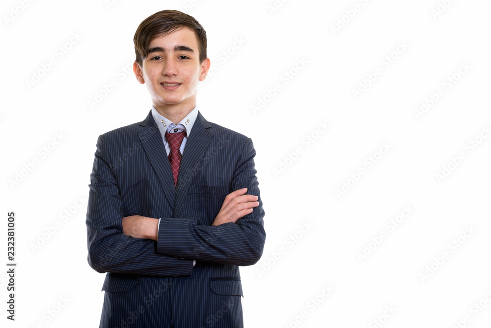 Studio shot of young happy Persian teenage businessman smiling w Studio shot of young happy Persian teenage businessman smiling w