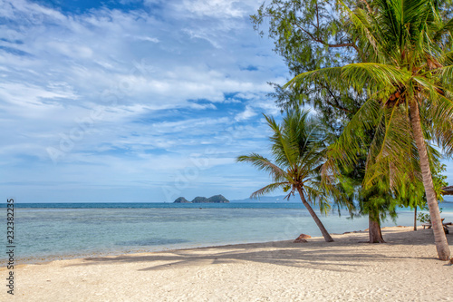 Beautiful tropical Thailand island panoramic with beach. Coconut trees stretch into the sea