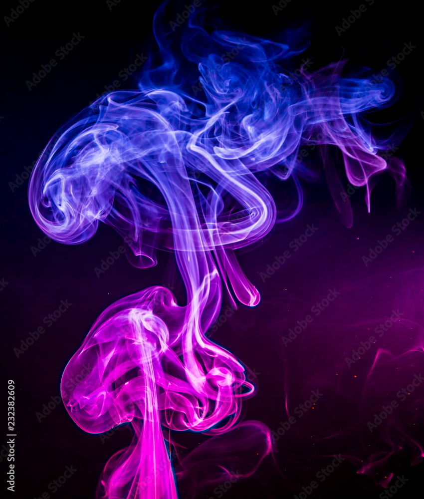 Obraz premium Colored smoke on black background