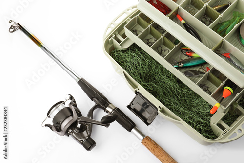 Fotografi Box with tackle and fishing rod on white background