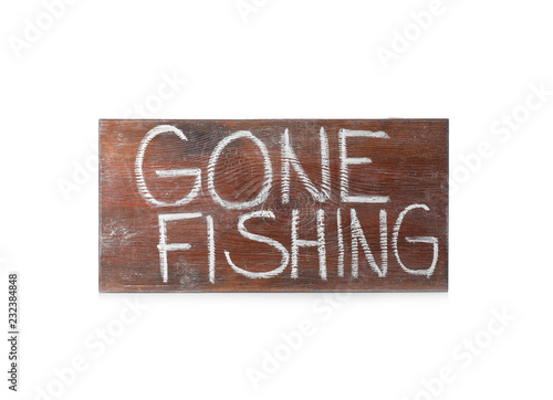 Valokuva Wooden plank with words GONE FISHING on white background