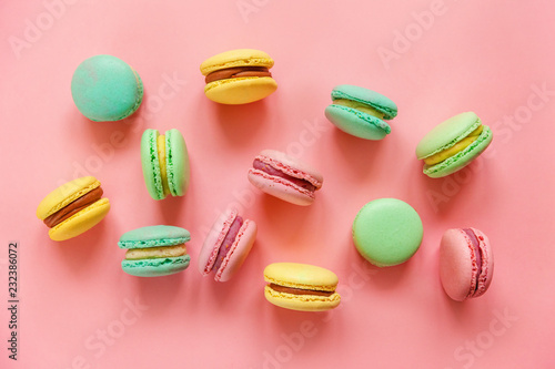 Wallpaper Mural Sweet almond colorful pink biue yellow green macaron or macaroon dessert cake isolated on trendy pink pastel background. French sweet cookie. Minimal food bakery concept. Flat lay top view copy space Torontodigital.ca