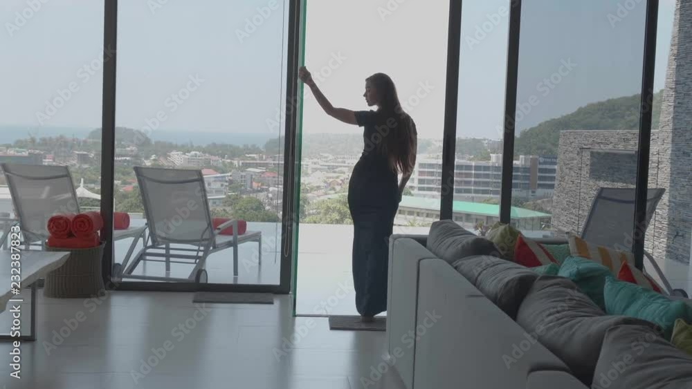 Beautiful red hair girl in elegant dress posing in luxurious modern interior - video in slow motion Beautiful red hair girl in elegant dress posing in luxurious modern interior - video in slow motion