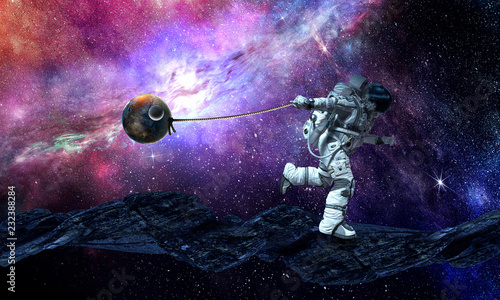 Fototapeta Naklejka Na Ścianę i Meble -  Spaceman steal planet. Mixed media