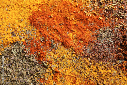Different aromatic spices as background, top view