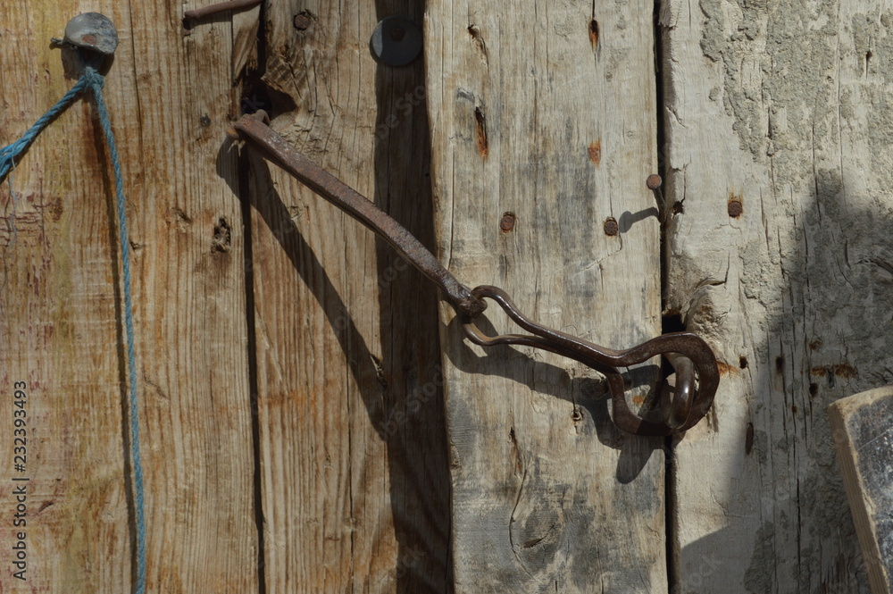 old lock on the wooden door old lock on the wooden door