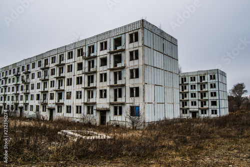 Old destroyed an abandoned multi-storey building in a military t © Максим Хасанов