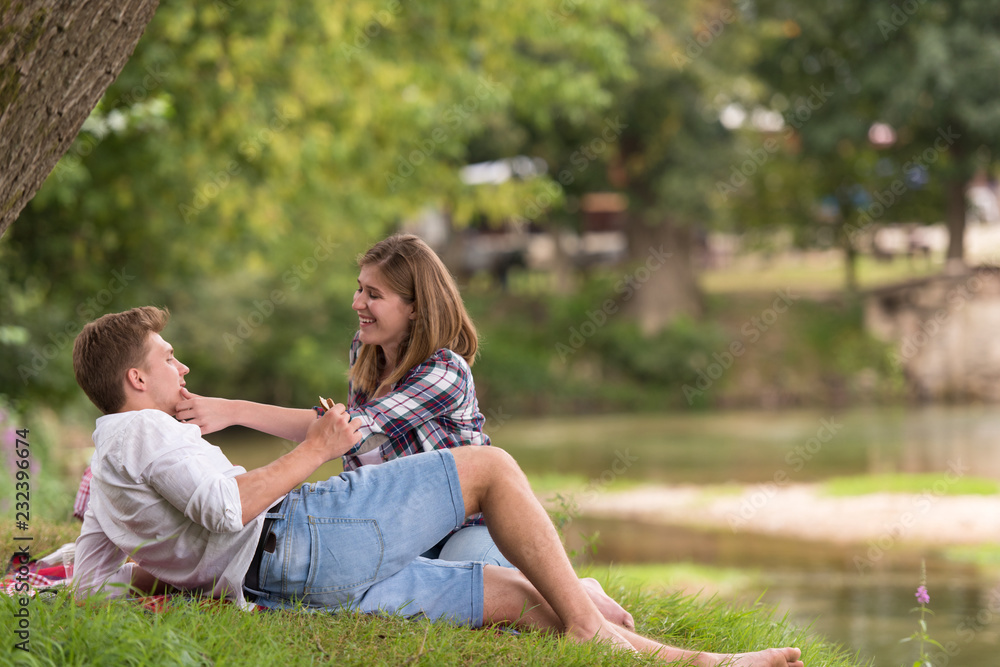 Couple in love enjoying picnic time