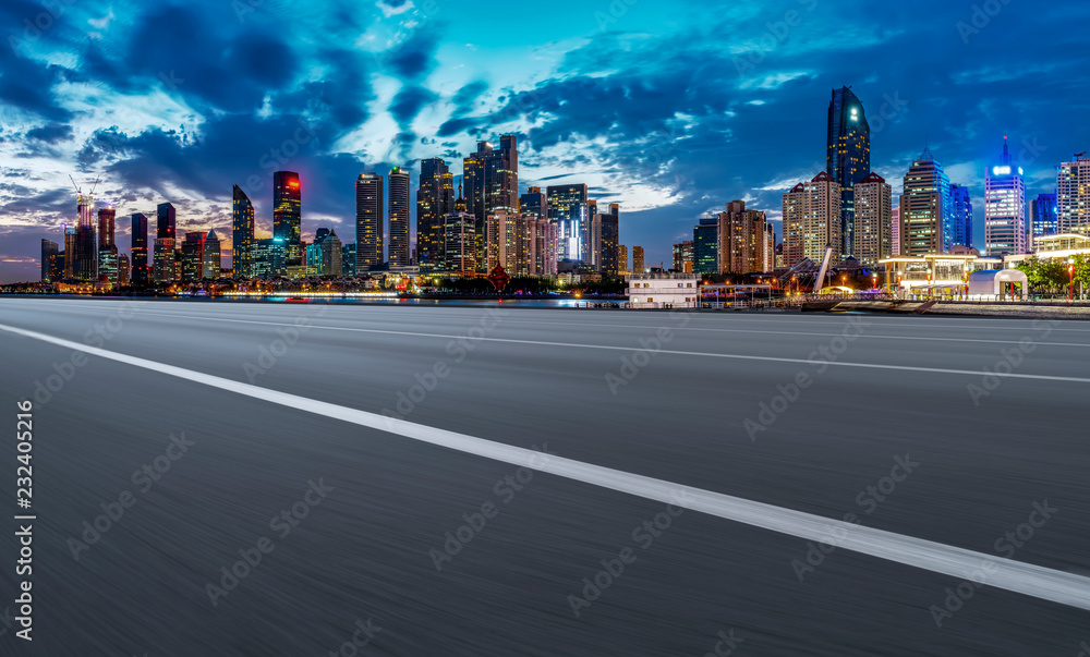 City skyscrapers and road asphalt pavement City skyscrapers and road asphalt pavement