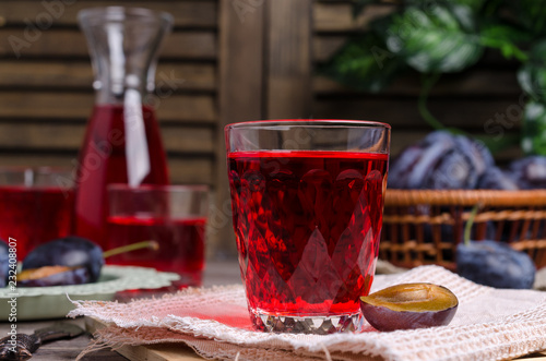 Obraz na plátně Transparent red drink in glass