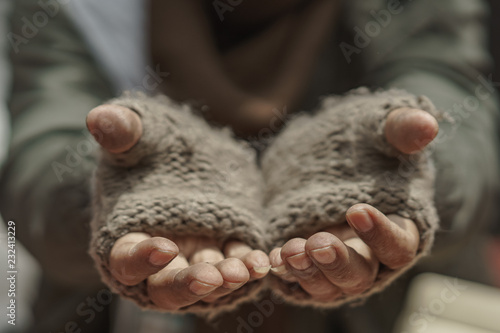 Close up hands of older homeless dirty poor beggar man waiting to help from donor. He so hungry, unhappy, have not money and feel lonely. photo