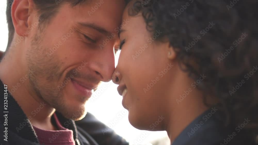 Couple standing face to face with eyes closed Couple standing face to face with eyes closed