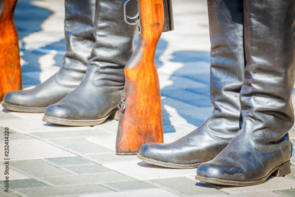 Build soldiers on the parade ground of the military unit in boots