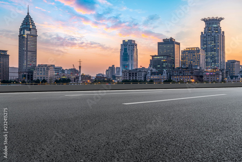 City skyscrapers and road asphalt pavement