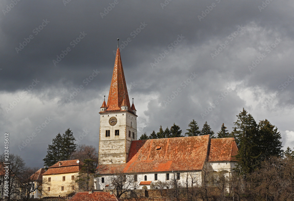 Fototapeta premium Cincu fortress under the dark clouds