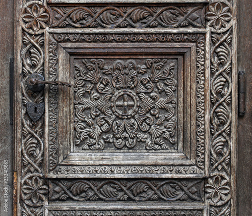 Wooden motifs on a medieval church door © MEDIAIMAG