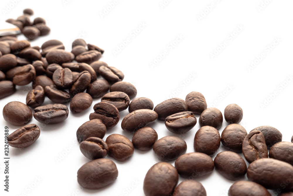 Roasted coffee beans on white background. Roasted coffee beans on white background.