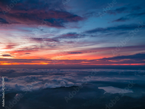 Beautiful Sunrise Sky with Sea of the mist of fog and heart shaped lake  in the morning on Khao Luang mountain in Ramkhamhaeng National Park,Sukhothai province Thailand © Sumeth