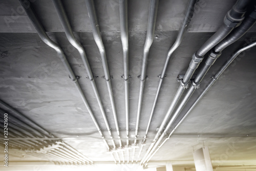 Metal Pipes line on grey ceiling