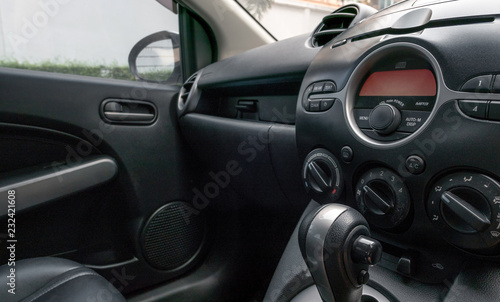 Car inside driver place. Front seats with dashboard control.