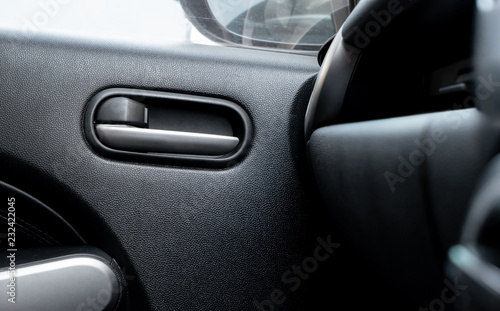 Car door lock lever inside driver place. © Lifestyle Graphic