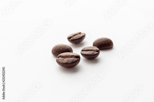 Roasted coffee beans on white background.