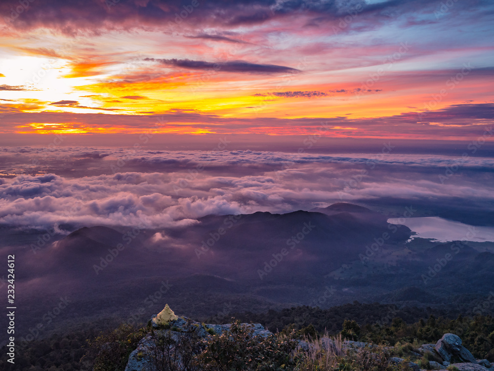 Beautiful Sunrise Sky with Sea of the mist of fog and Small Golden pagoda in the morning on Khao Luang mountain in Ramkhamhaeng National Park,Sukhothai province Thailand Beautiful Sunrise Sky with Sea of the mist of fog and Small Golden pagoda in the morning on Khao Luang mountain in Ramkhamhaeng National Park,Sukhothai province Thailand