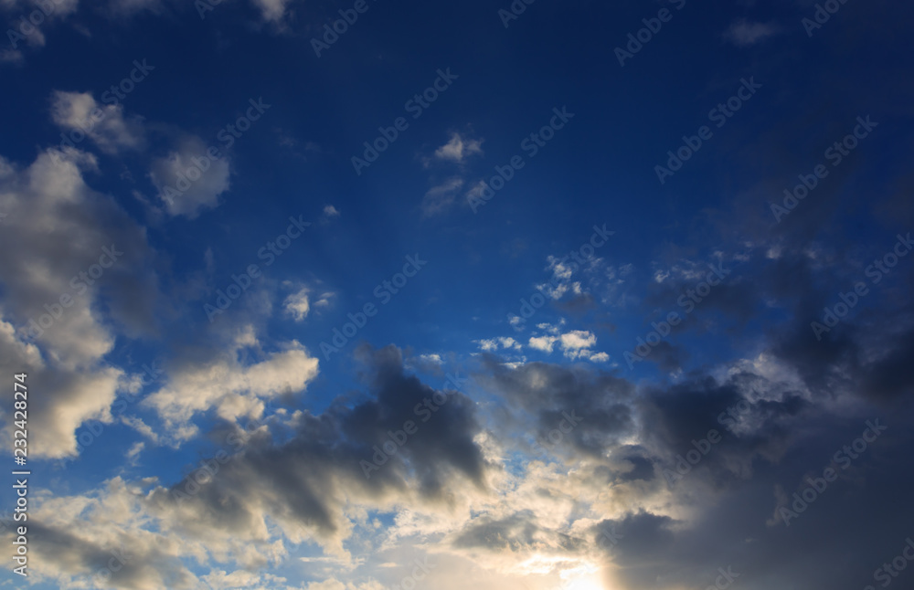 Fototapeta premium Clouds after rain before sunset as a background