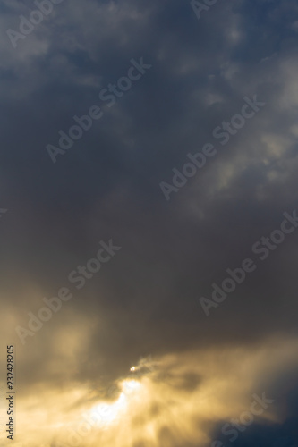 Clouds after rain before sunset as a background