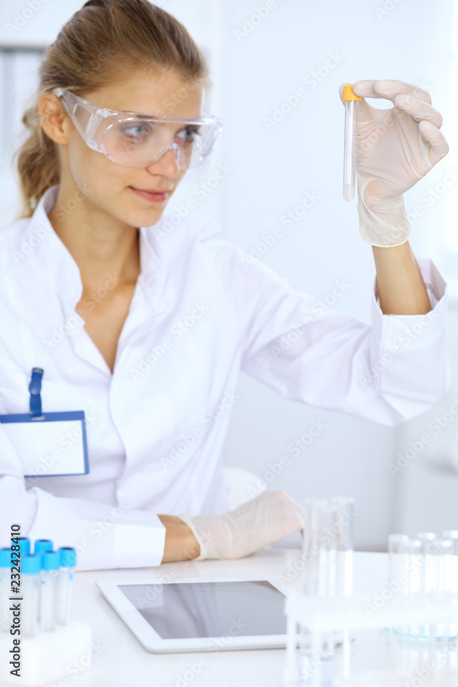 Female scientific researcher or blood test assistant in laboratory. Medicine concept Female scientific researcher or blood test assistant in laboratory. Medicine concept