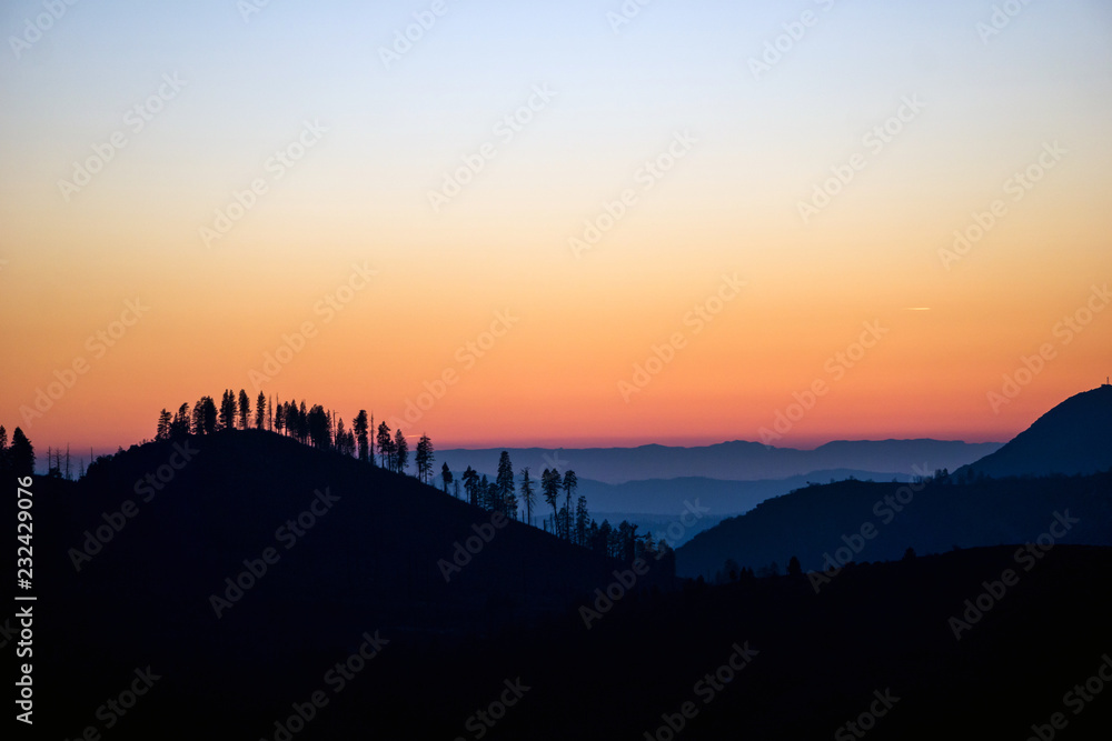 Colorful Sunset at Yosemite National Park - Silhouette of Trees and Mountains